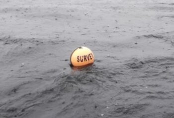 Marked by orange buoys
